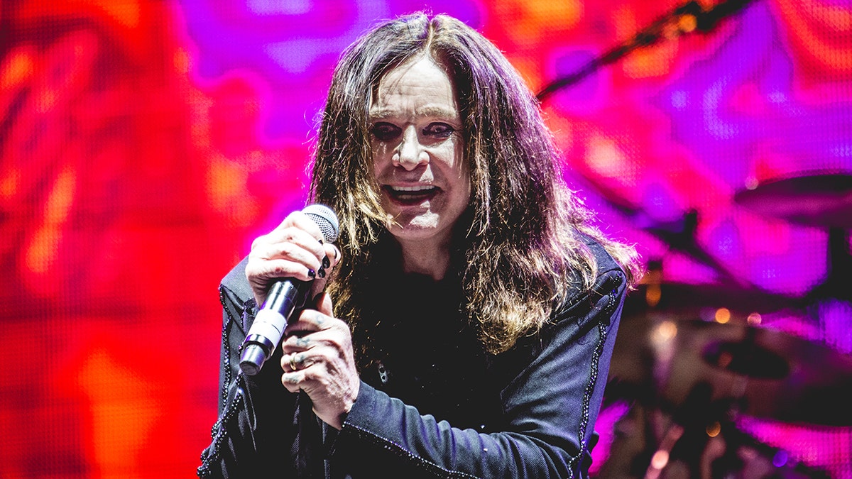 Ozzy Osbourne performing onstage.