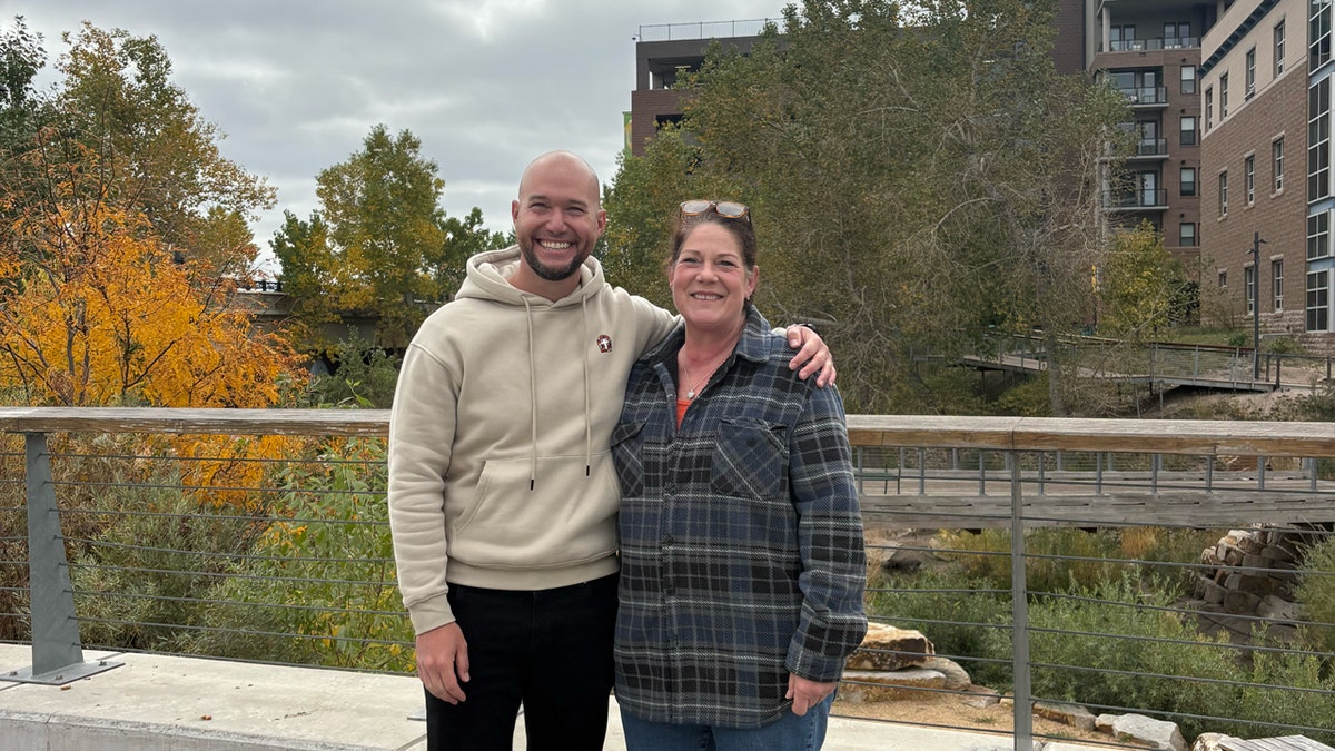 Pastor Neal Seiwert posing with delivery driver Suzanna in Colorado.