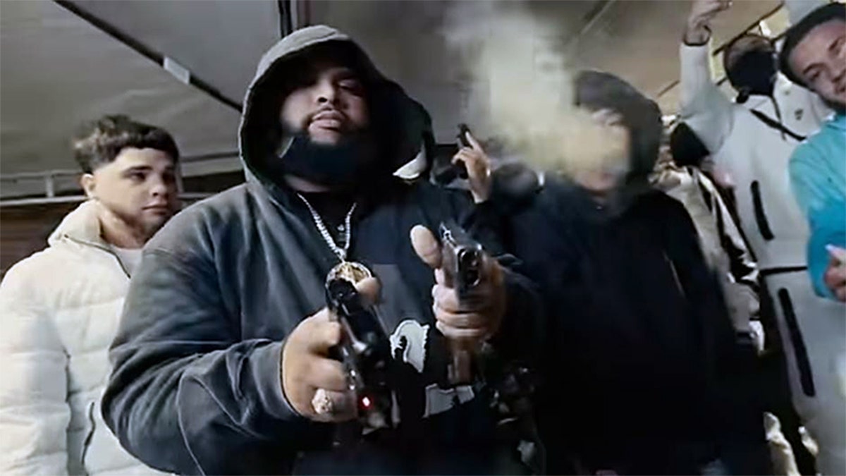 Men posing with guns during Pennsylvania drug investigation.
