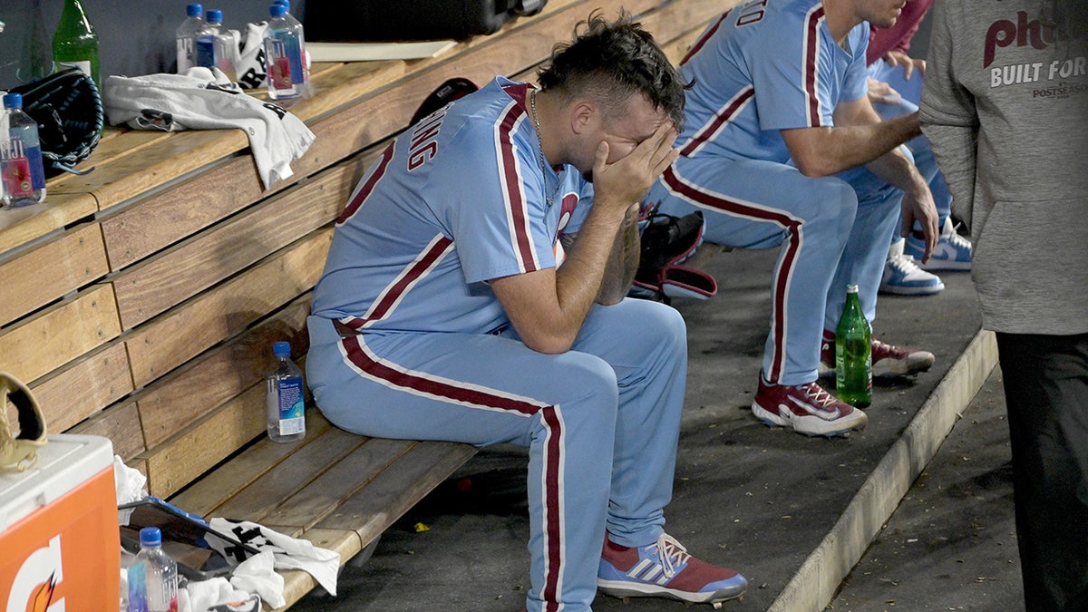 Orion Kerkering sits in dugout