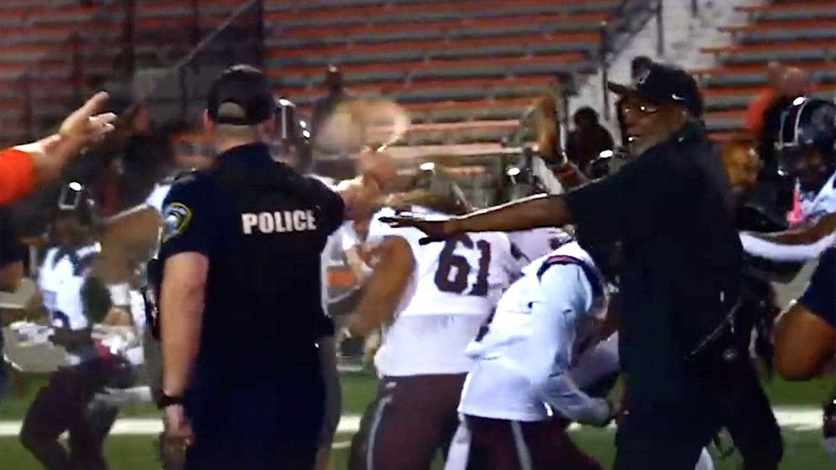 Police using pepperspray on football players