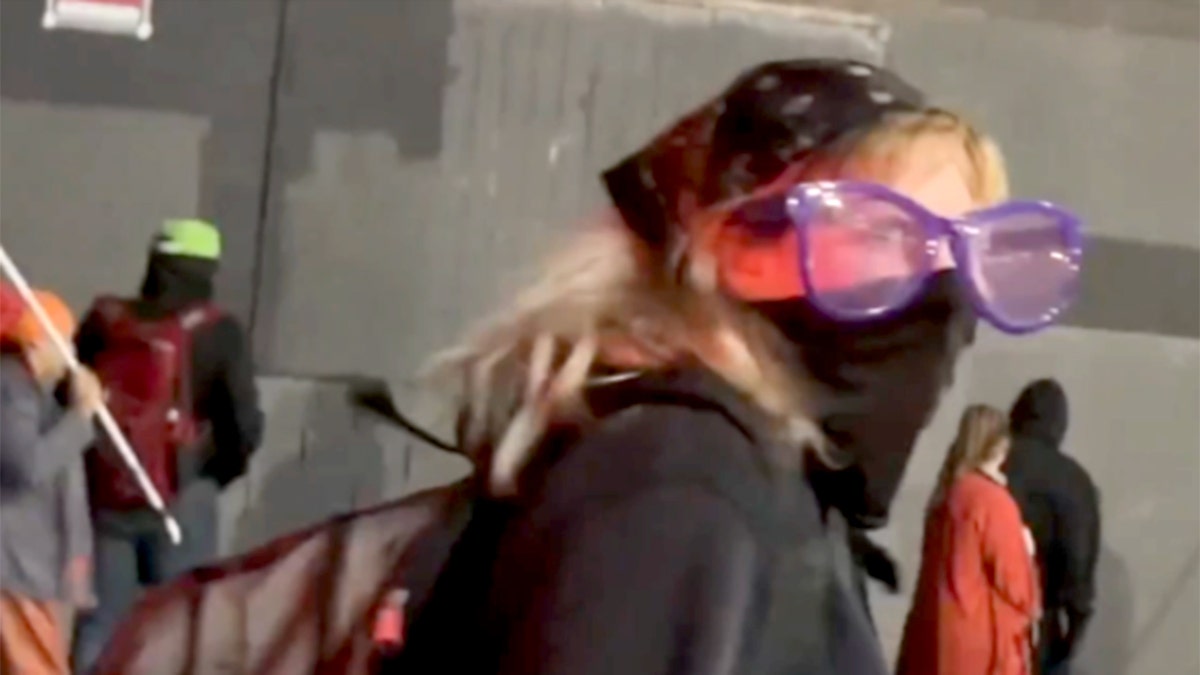 Person with bandana, glasses and mask