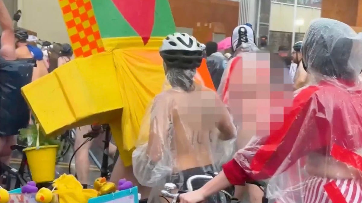 Bare-bottomed bikers roll through rain to shout at feds in blue city's latest anti-ICE stunt  at george magazine