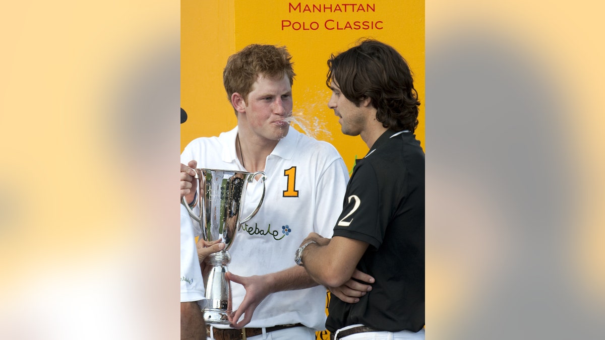 Prince Harry spitting champagne at Nacho Figueras.