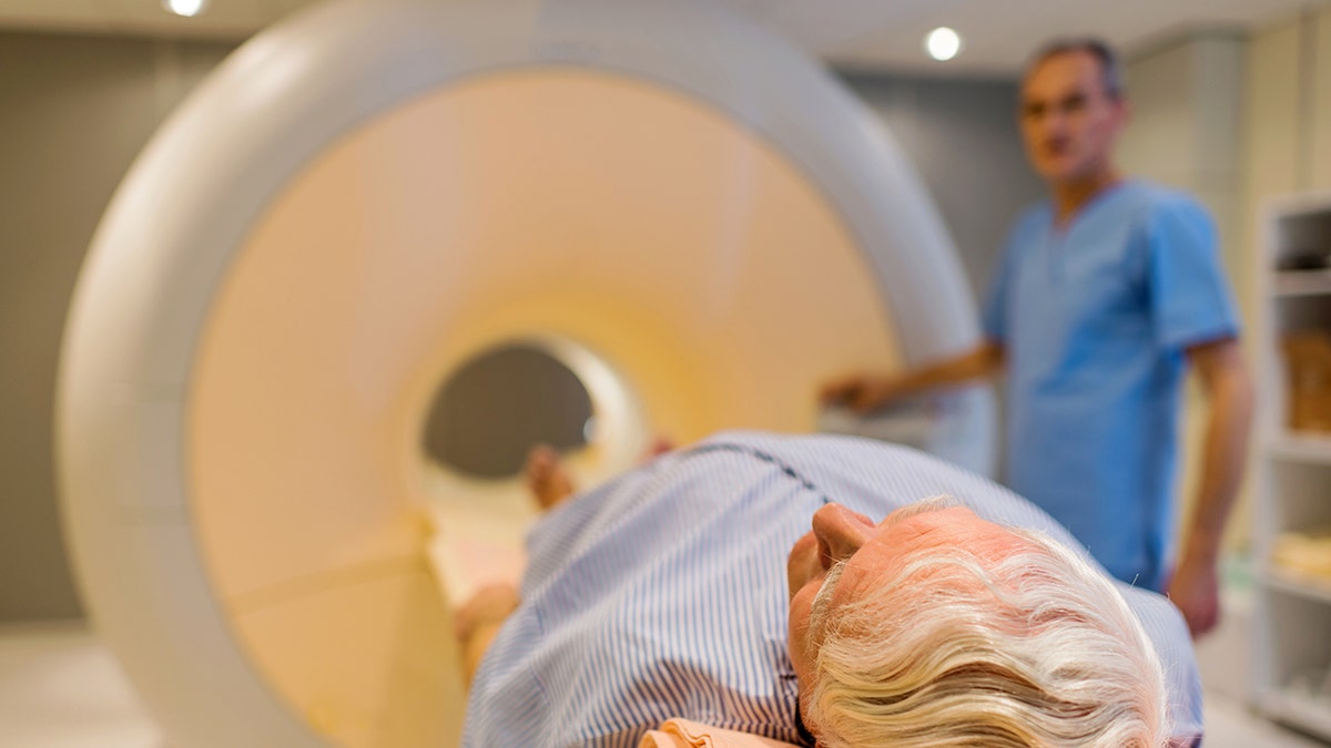 Senior male patients lying in MRI examination.