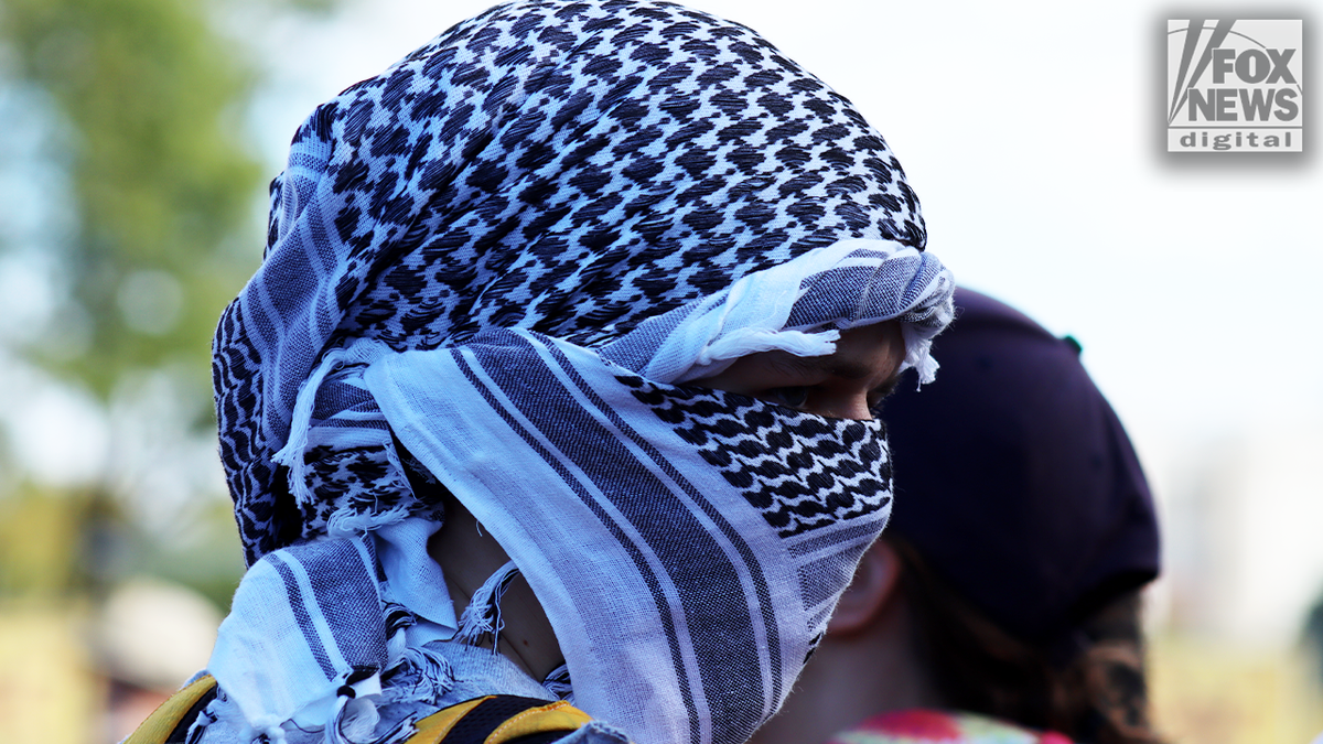 protester with a keffiyeh