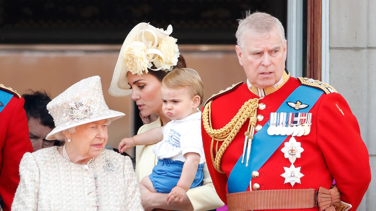 Prince Andrew and Queen Elizabeth looking on as Kate Middleton holds a baby Prince Louis.