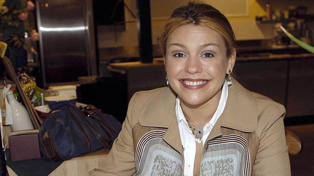 Rachael Ray signs one of her books at an event in 2005