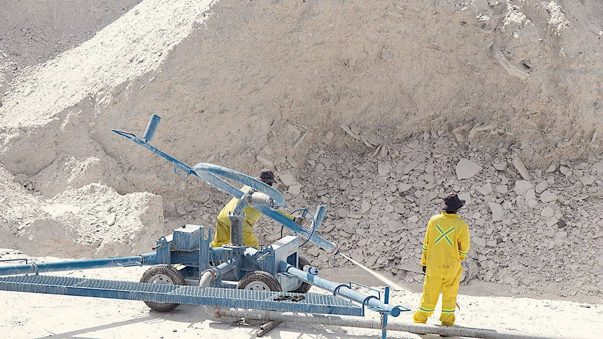 Miners in South Africa mine rare earth site.