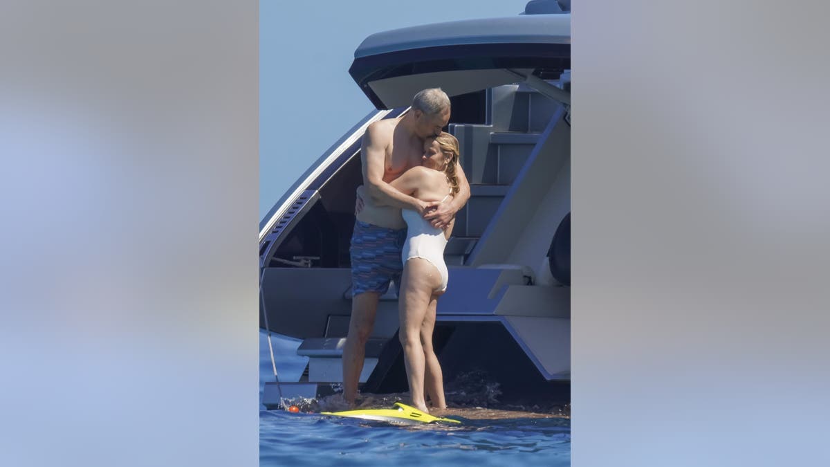 Reese Witherspoon kisses boyfriend Oliver Haarmann aboard a luxury yacht during their romantic Saint-Tropez getaway.