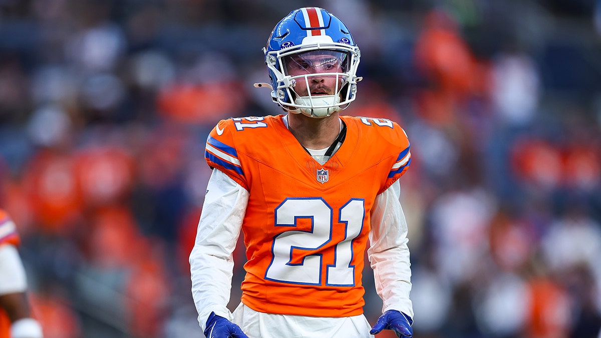 Riley Moss stands on field