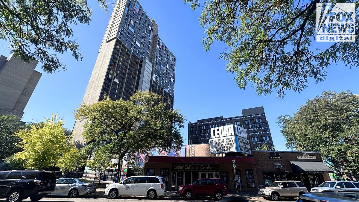 Riverside Plaza towers behind Cedar Cultural Center in Minneapolis