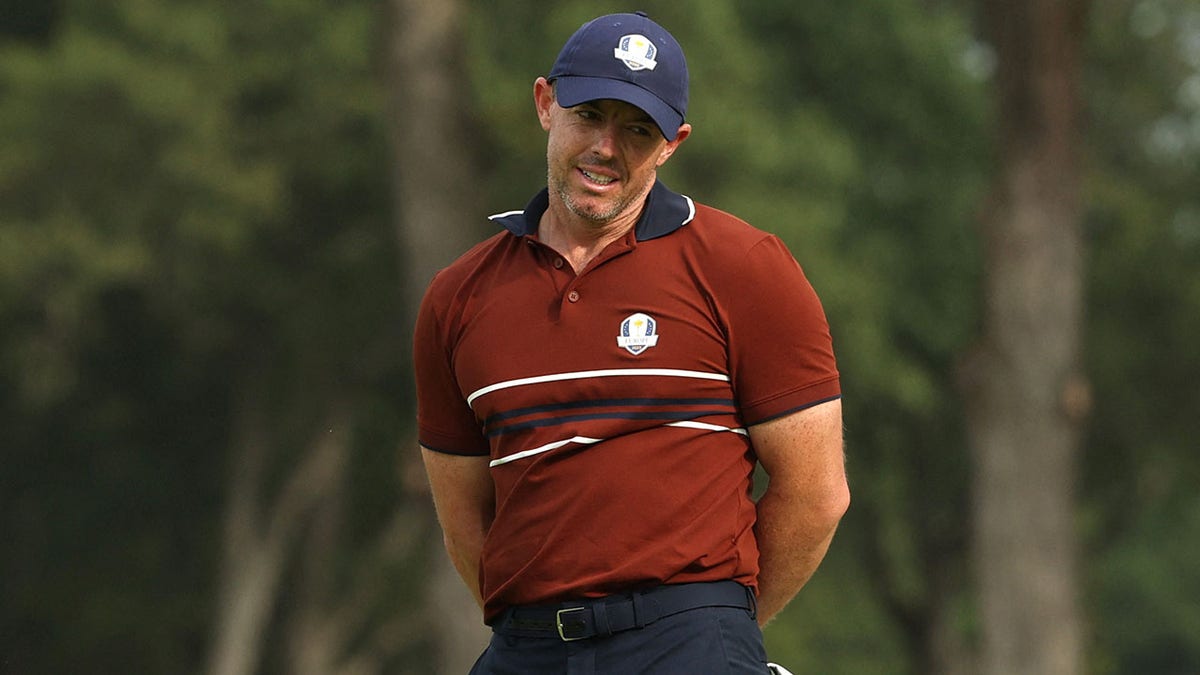 Rory McIlroy reacts on course