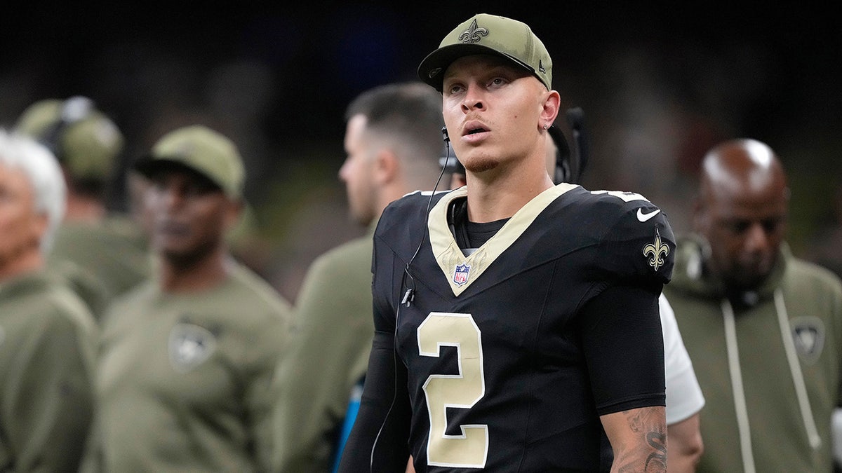 Spencer Rattler looks on