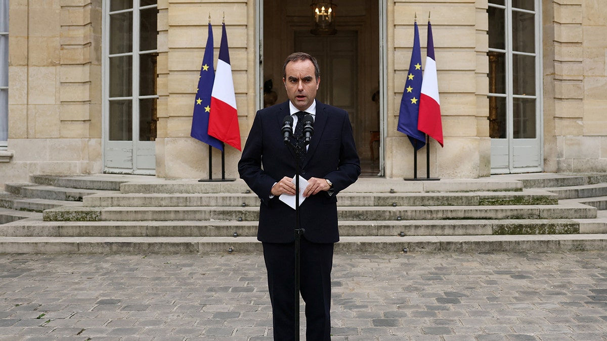 Sebastien Lecornu speaking outside building