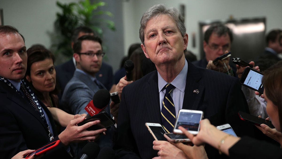 Sen John Kennedy speaks to reporters