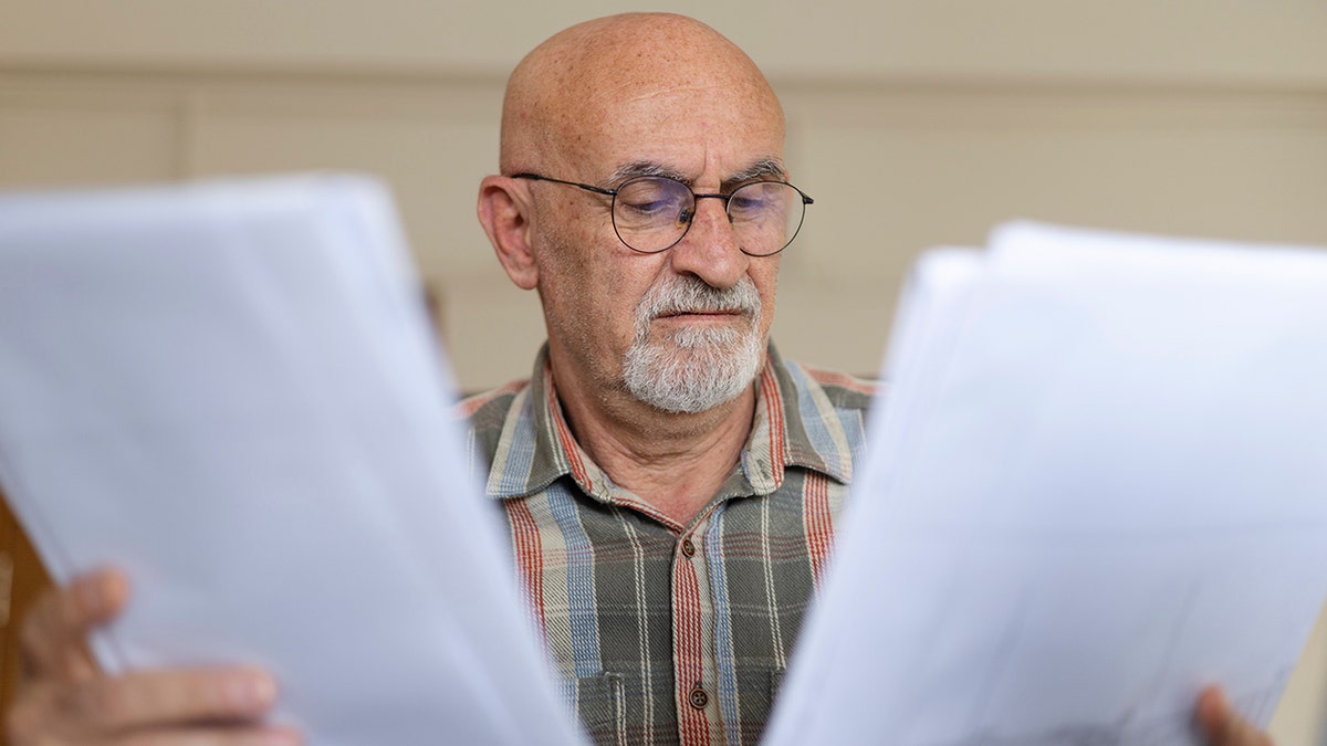 The man reviews the inheritance documents