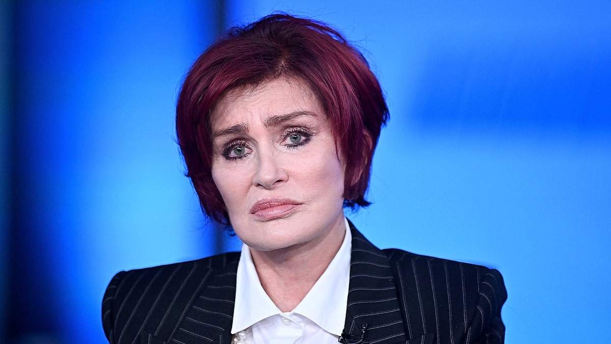 Sharon Osbourne pinstripe suit