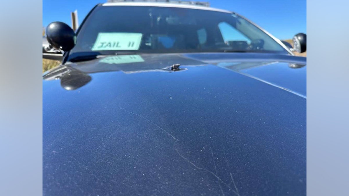 Shrapnel on CHP vehicle