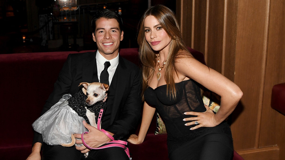 Sofia Vergara in a black dress with her son Manolo Gonzalez Vergara and their dog