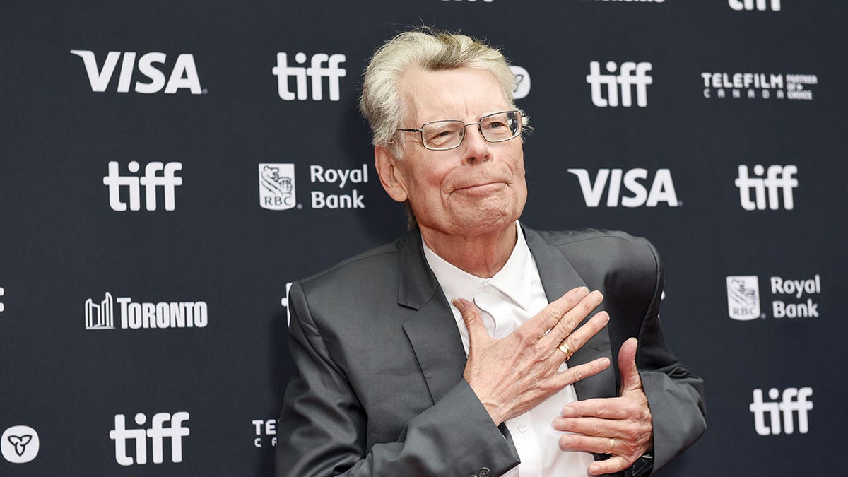 Stephen King looks on