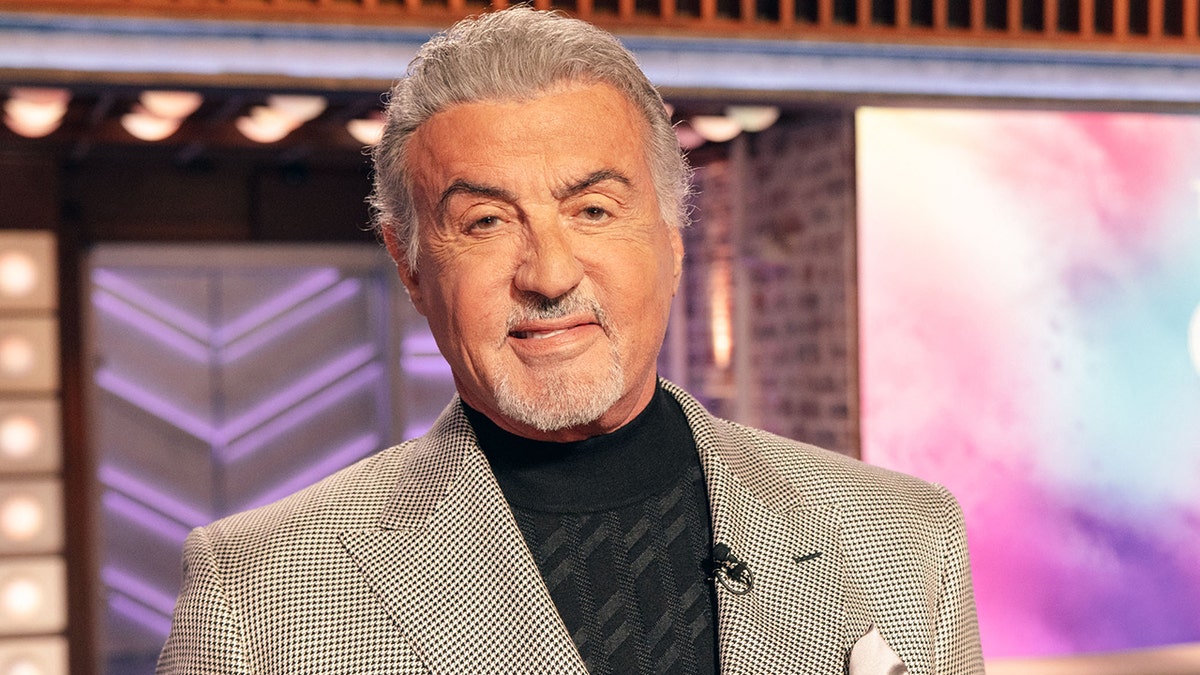 Sylvester Stallone in a black and white suit jacket while on The Kelly Clarkson Show in September 2025.