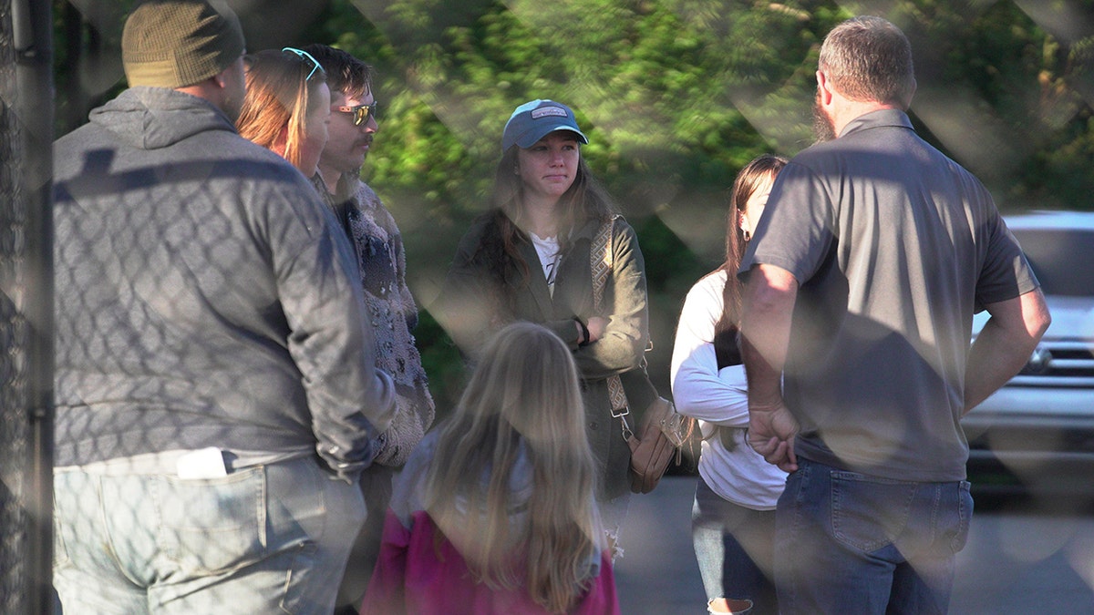Family members outside Accurate Energetic Systems plant following explosion in Tennessee