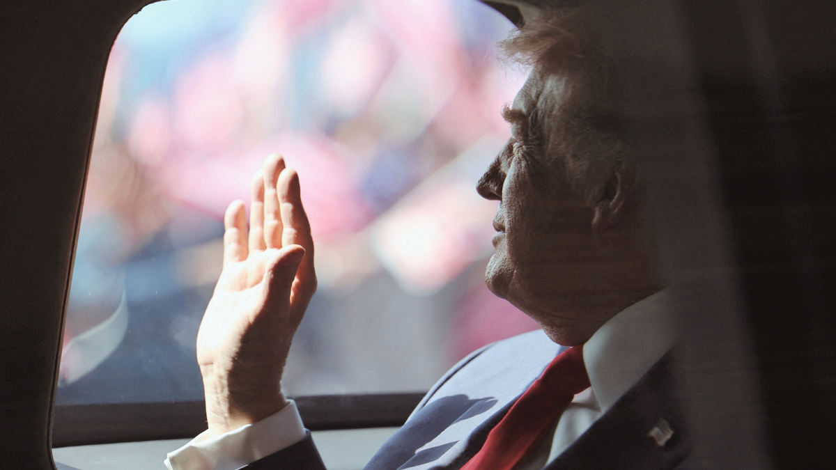U.S. President Donald Trump waves at crowds in Malaysia