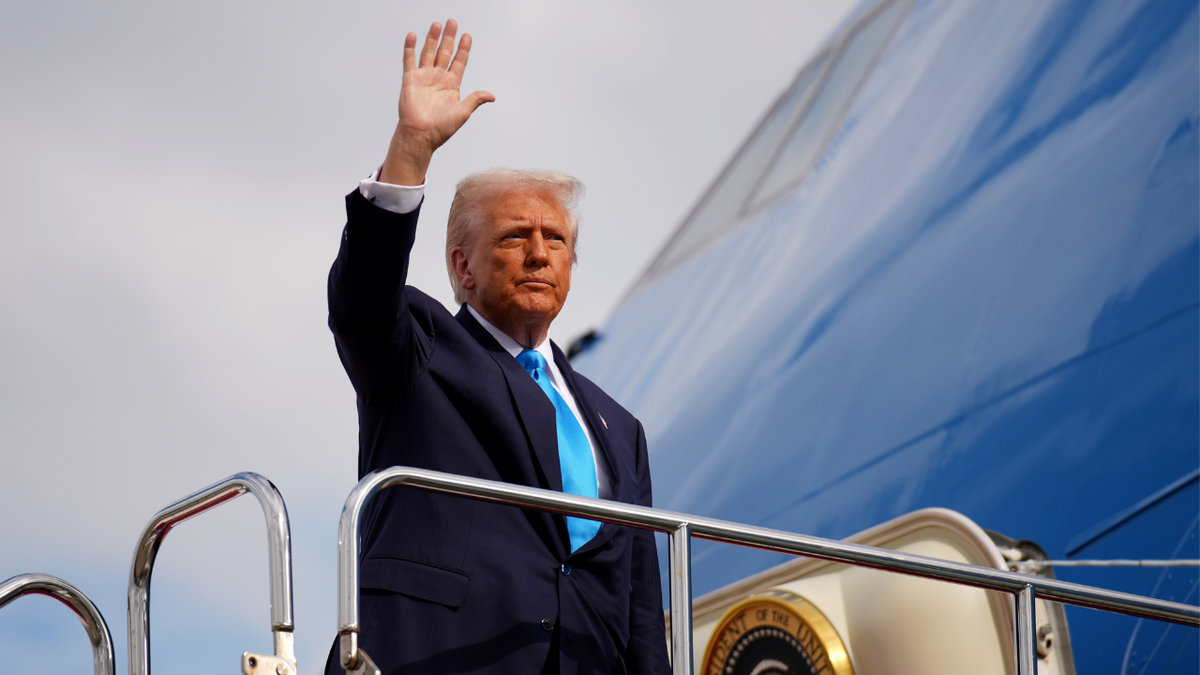 President Donald Trump boards Air Force One in Japan on his way to South Korea