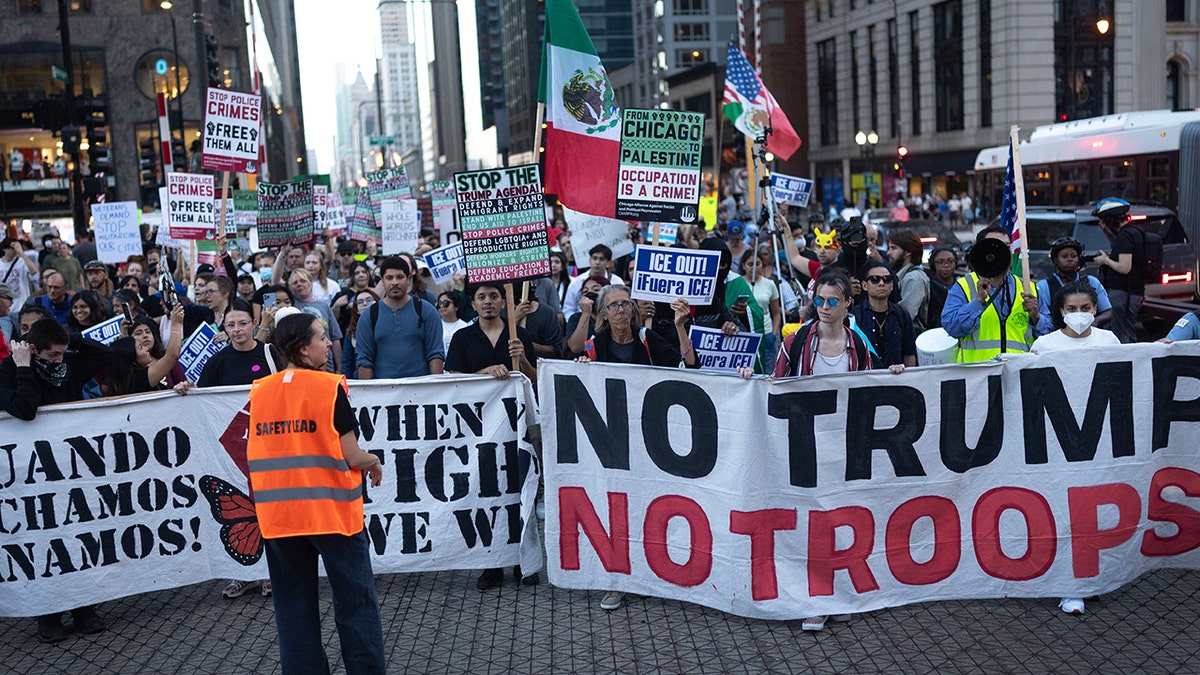 Demonstrators march through downtown Chicago