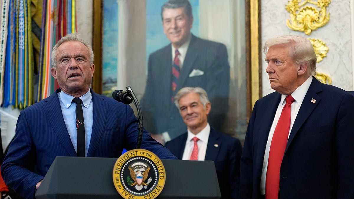 President Donald Trump listens as Health and Human Services Secretary Robert F. Kennedy Jr., in the White House.