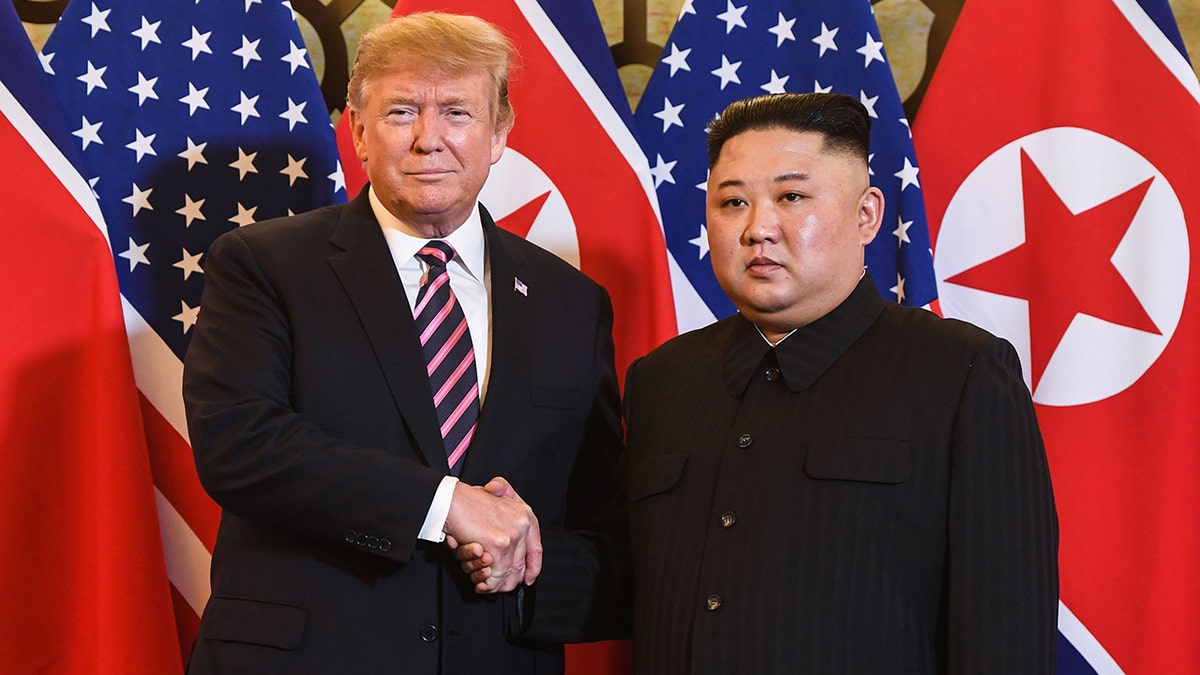 President Donald Trump shakes hands with North Korea's Kim Jong Un