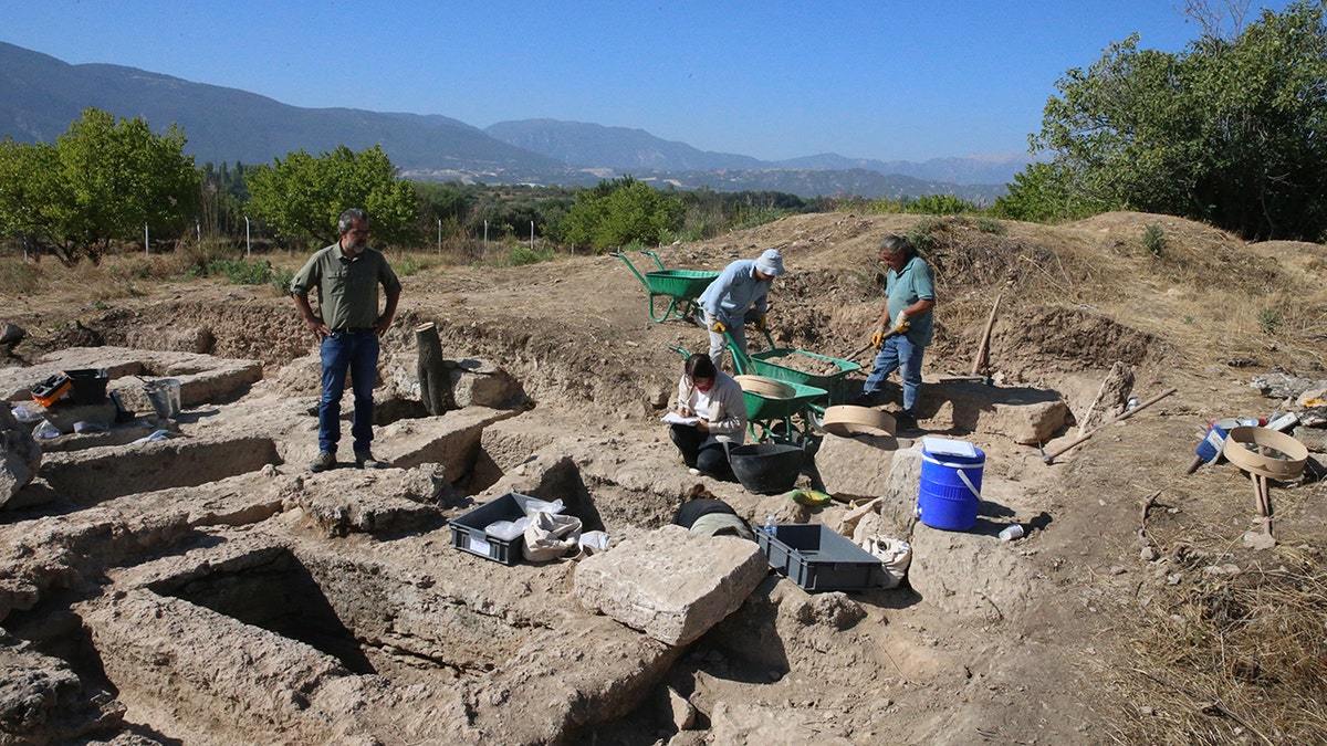 Archaeologists uncover 2,200-year-old ancient tombs in Colossae, Turkey 2 Excavators digging near graves