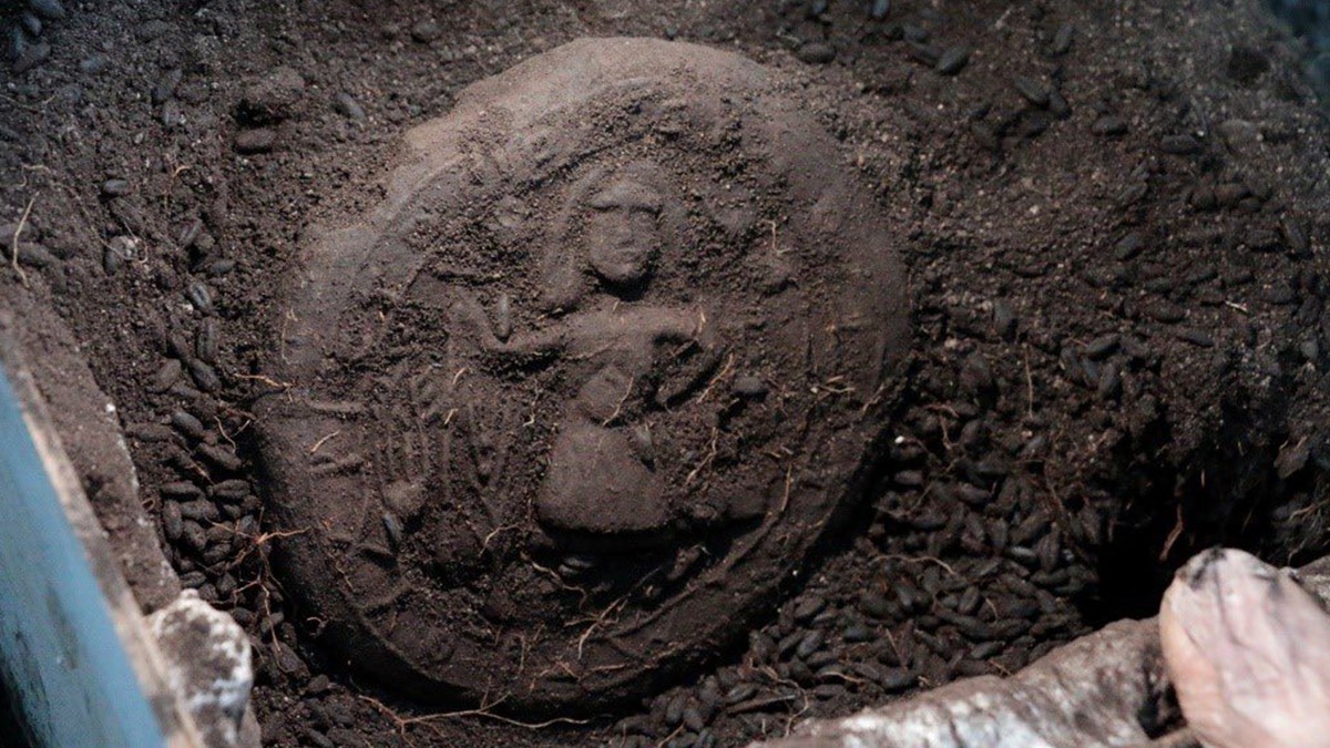Bread loaf of Jesus in dirt at excavation site