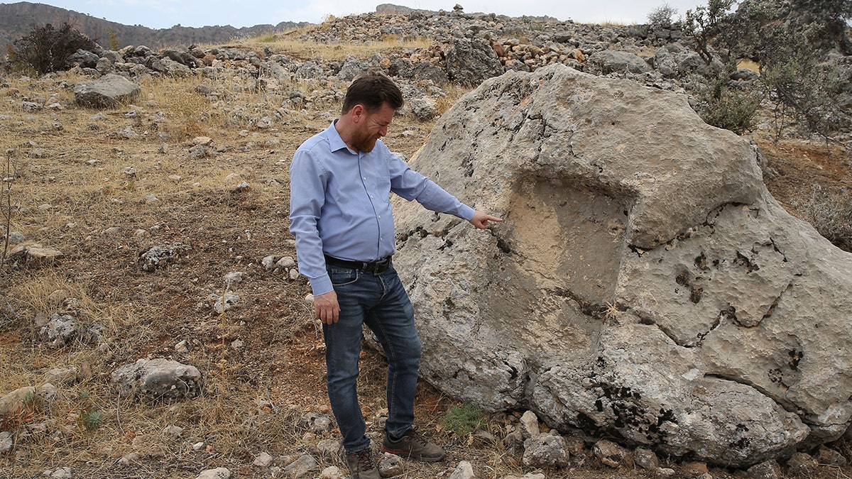 Ancient wine production center discovered in Turkey dates back 1,600 years 2 Official standing near roman structure