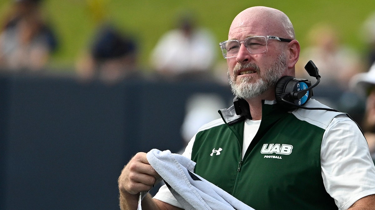 Trent Dilfer watches his team play Navy
