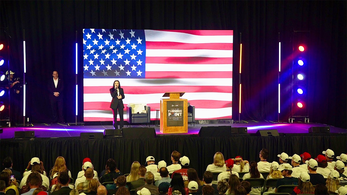 US flag on stage of TPUSA event