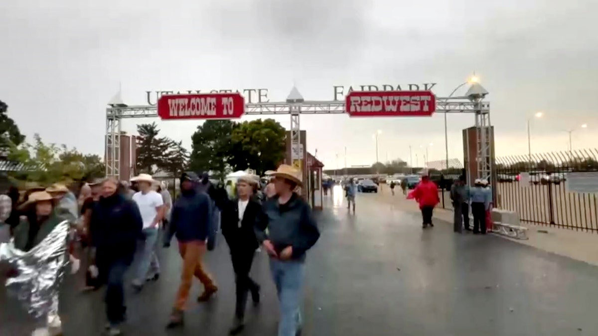 concertgoers evacuating RedWest music festival