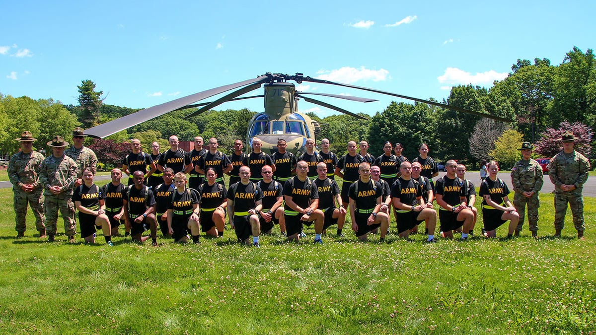 Valley Forge Military College students in front of Blackhawk helicopter