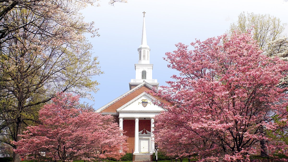 Valley Forge Military college chapel in spring with pink trees blossoming