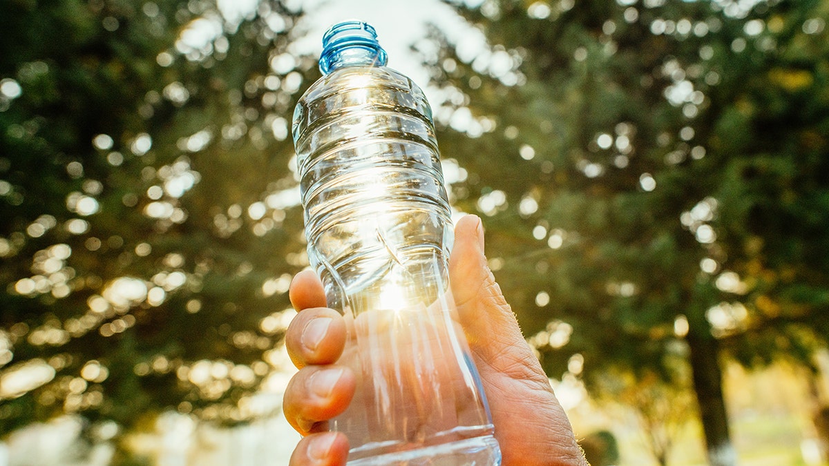water bottle held up to the sun