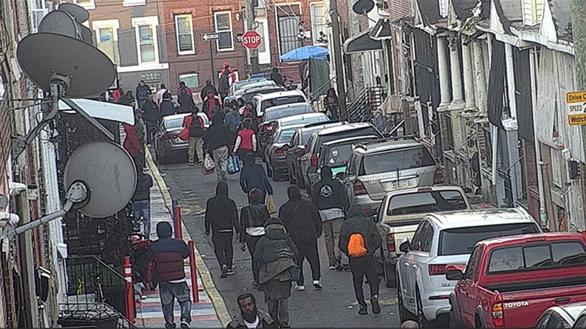 Crowds gathered in Philadelphia open-air drug market.