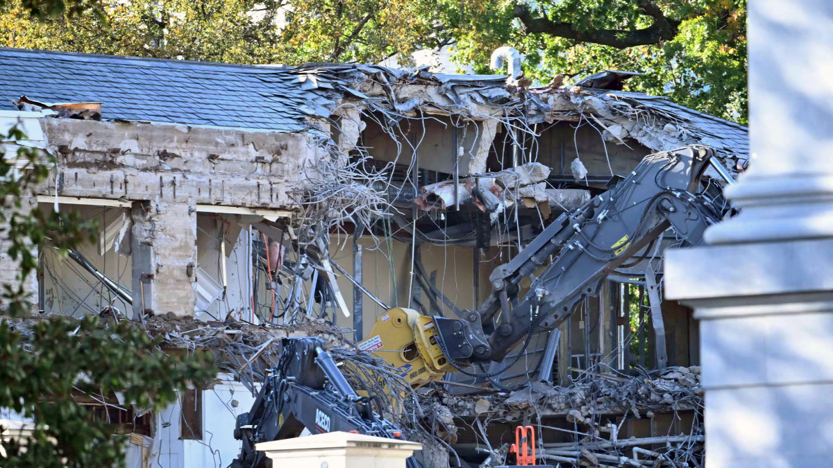 Heavy machinery tears down a section of the East Wing of the White House