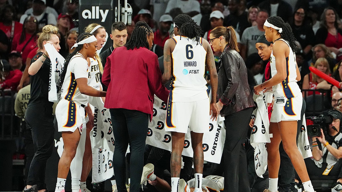Fever staff gather around Kelsey Mitchell