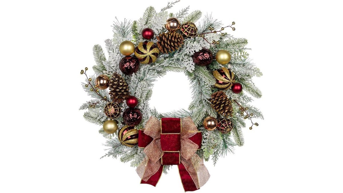 This 24-inch flocked Christmas wreath is ready to hang on your front door.