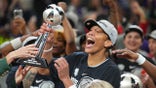 A'ja Wilson holds the WNBA Finals MVP trophy