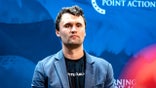Charlie Kirk gets ready to speak before a Turning Point USA event