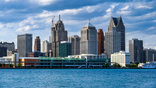 Detroit skyline seen from water with buildings and sky