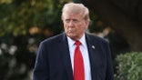 Donald Trump walking on White House lawn