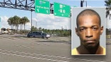 Jeremy Rouse, right, next to I-4 interchange in Altamonte Springs